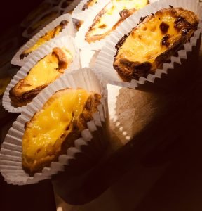 Coffee Circus freshly baked Portuguese-style custard tarts with golden caramelized tops served alongside specialty coffee at Porto Msida location