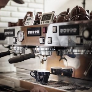 Coffee Circus barista preparing espresso on a commercial coffee machine
