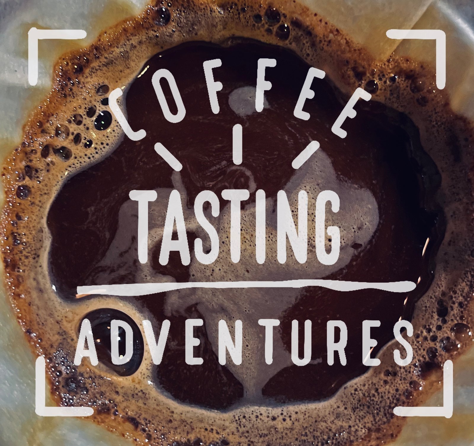 Fresh brewed coffee with crema in white cup featuring Coffee Tasting Adventures branding